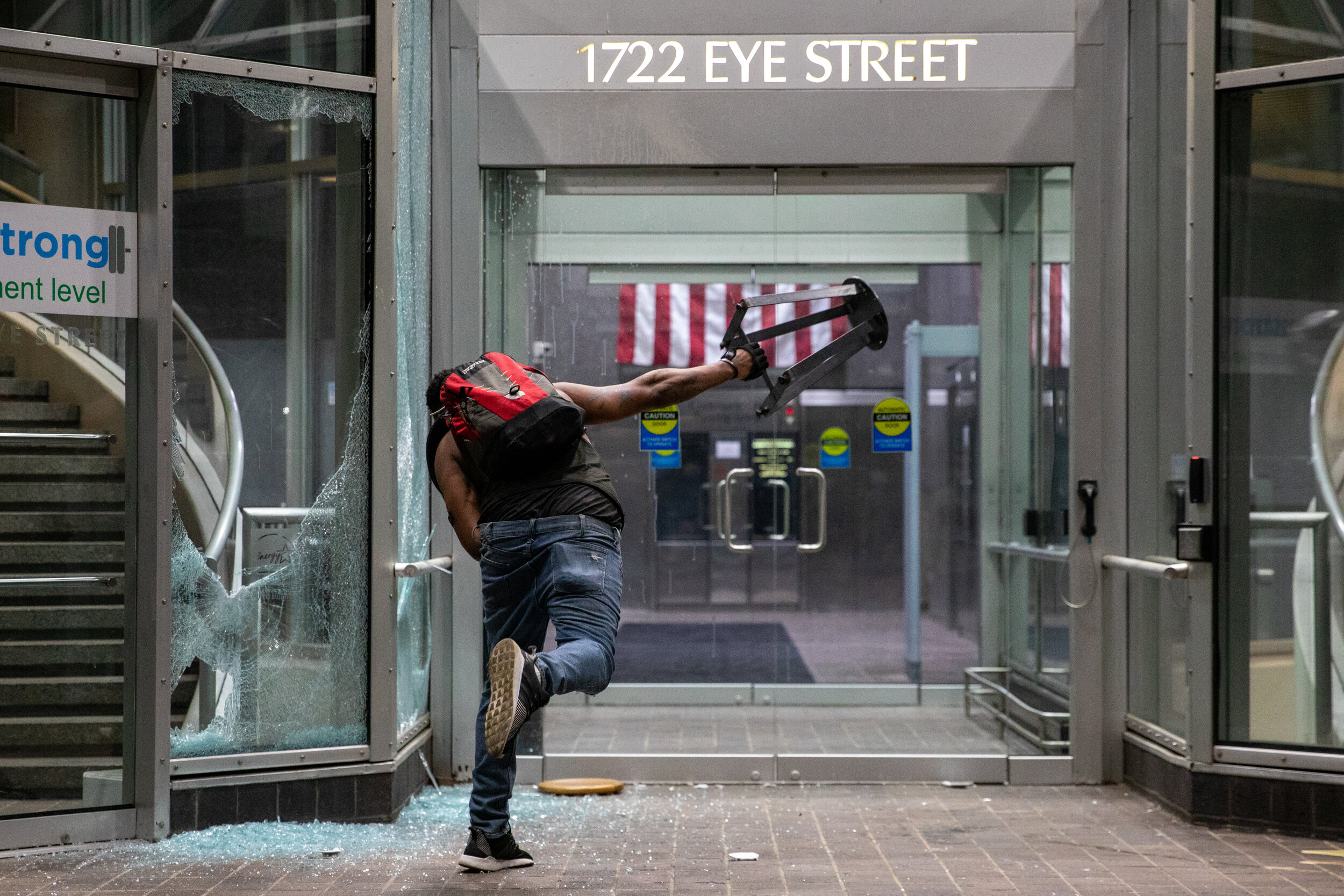 Protesters destroy the door of a building during a rally against police brutality against unarmed black men following the death of George Floyd, who was killed in Minneapolis, Minnesota, near the White House in Washington, D.C., USA on Sunday, May 3