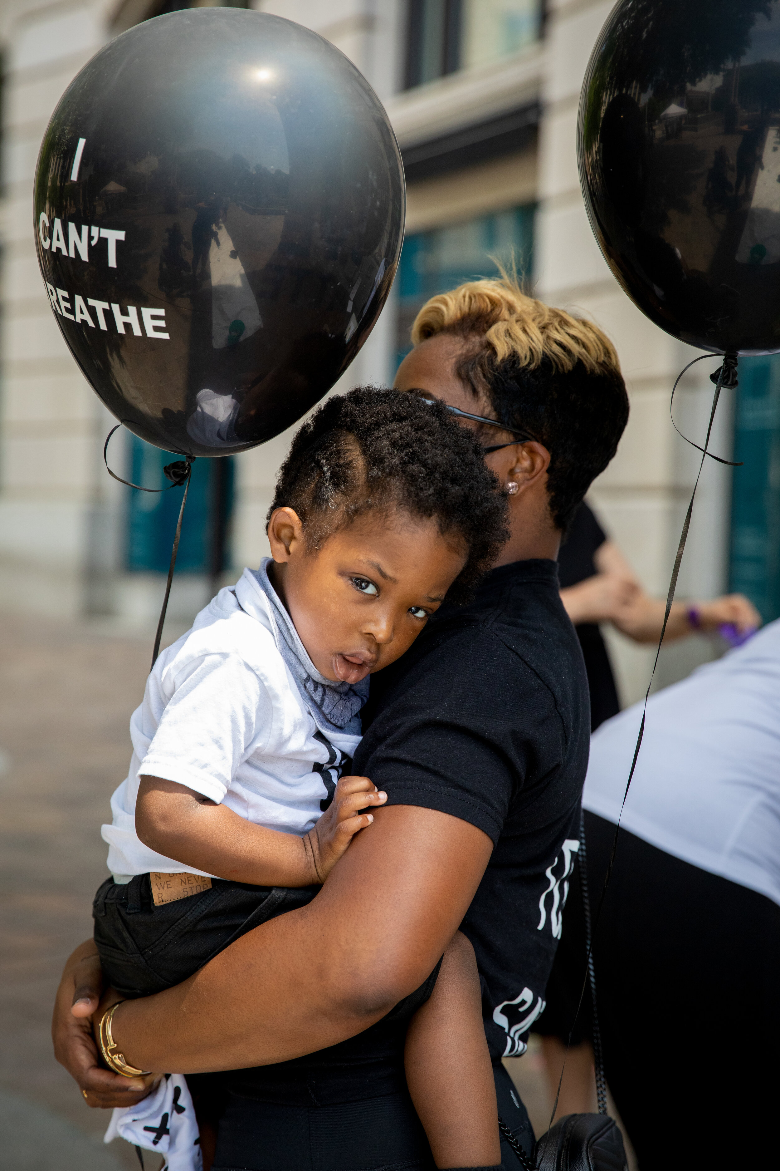 Michaela Cook St. Croi holds her son Mason Cook St. Croi, 2, at the Black Mama's March in Washington, D.C. on Saturday, June 27, 2020. (Photo made for The Washington Post)
