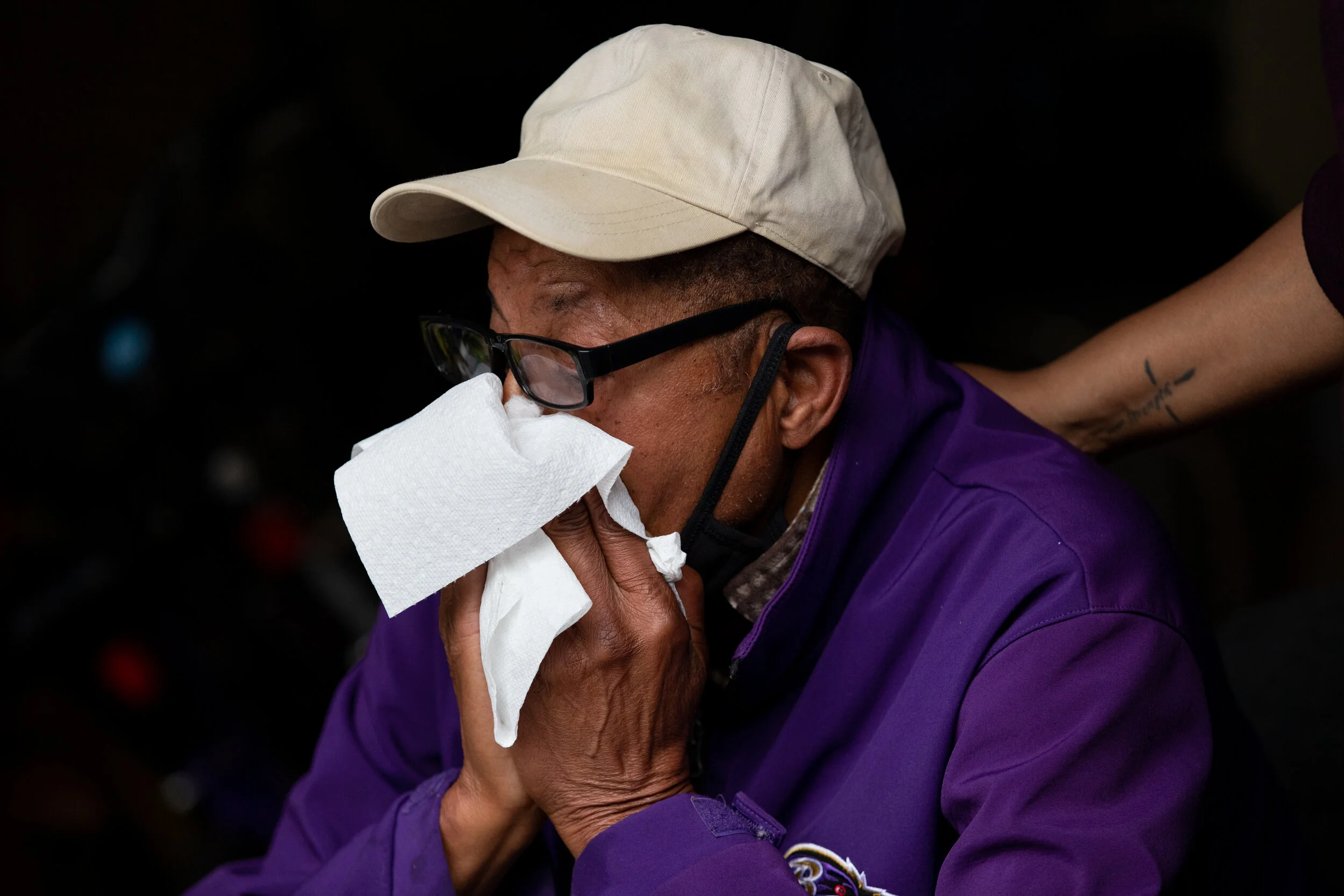  Juanette Long-Coates, 43, comforts Ernest Davis, 74, over the loss of his fiancée Dale Coates at their home in Annapolis, Maryland. When I arrived at the house, Davis was crying alone in the garage. (Photo made for The Washington Post) 