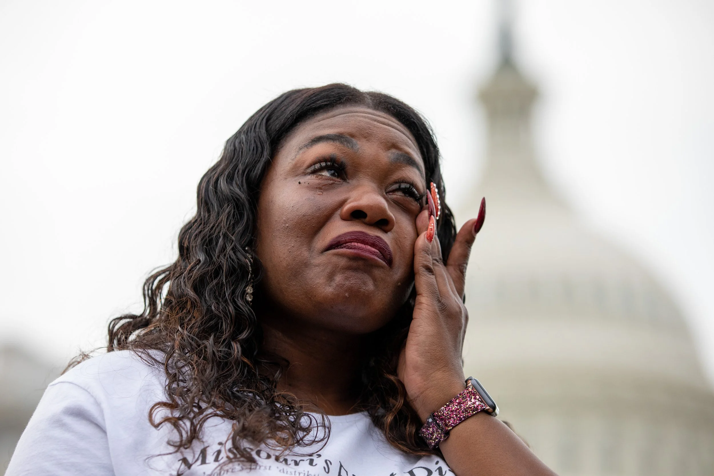  Rep. Cori Bush, D-Mo., cries after it was announced that the Biden administration will enact a targeted nationwide eviction moratorium outside of Capitol Hill in Washington on Tuesday, August 3, 2021. For the previous five days, lawmakers and activi