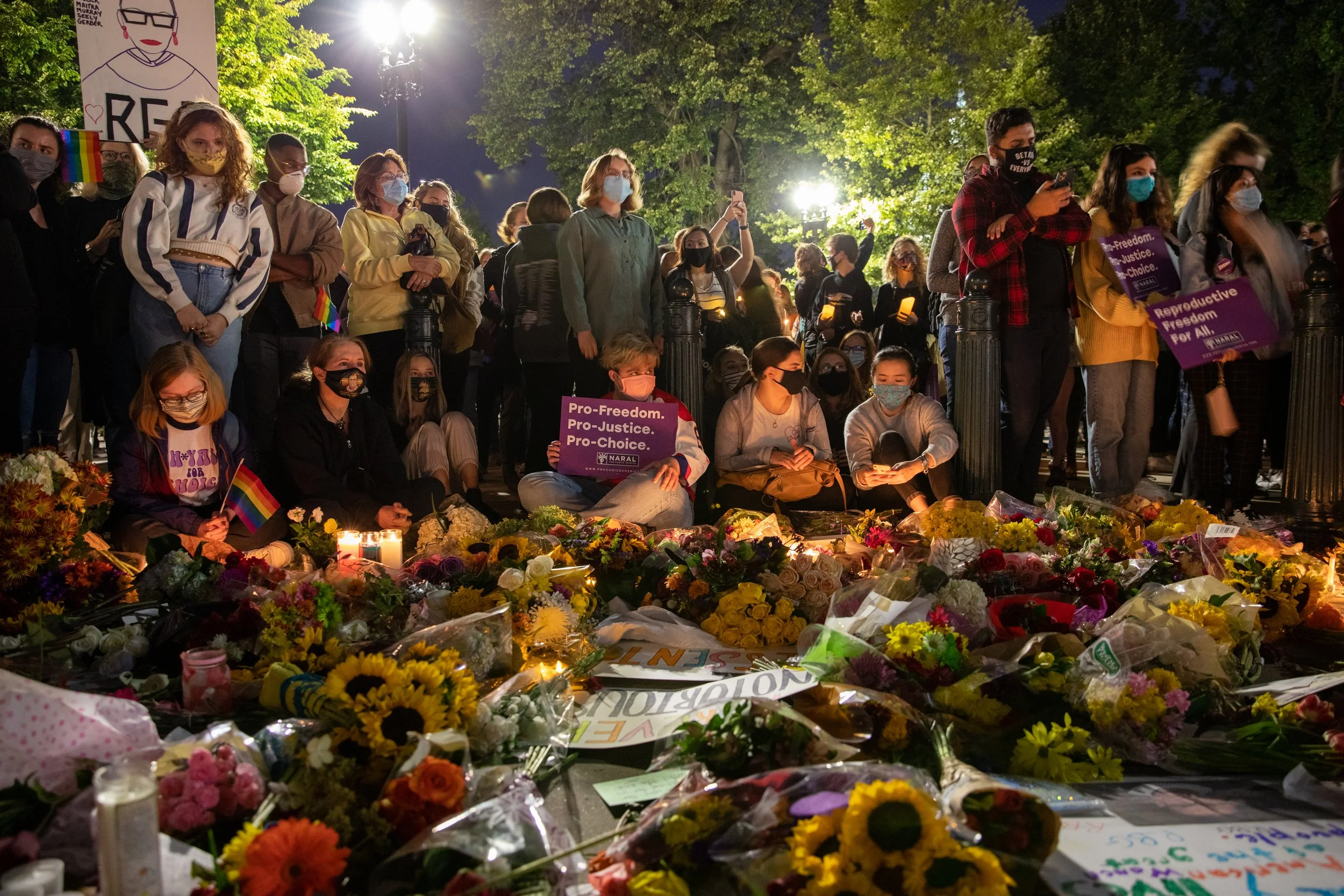  Mourners gather during a vigil in honor of the late Justice Ruth Bader Ginsburg in front of the Supreme Court of the United States in Washington, D.C., US on Saturday, September 19, 2020.  (Amanda Andrade-Rhoades/Bloomberg) 