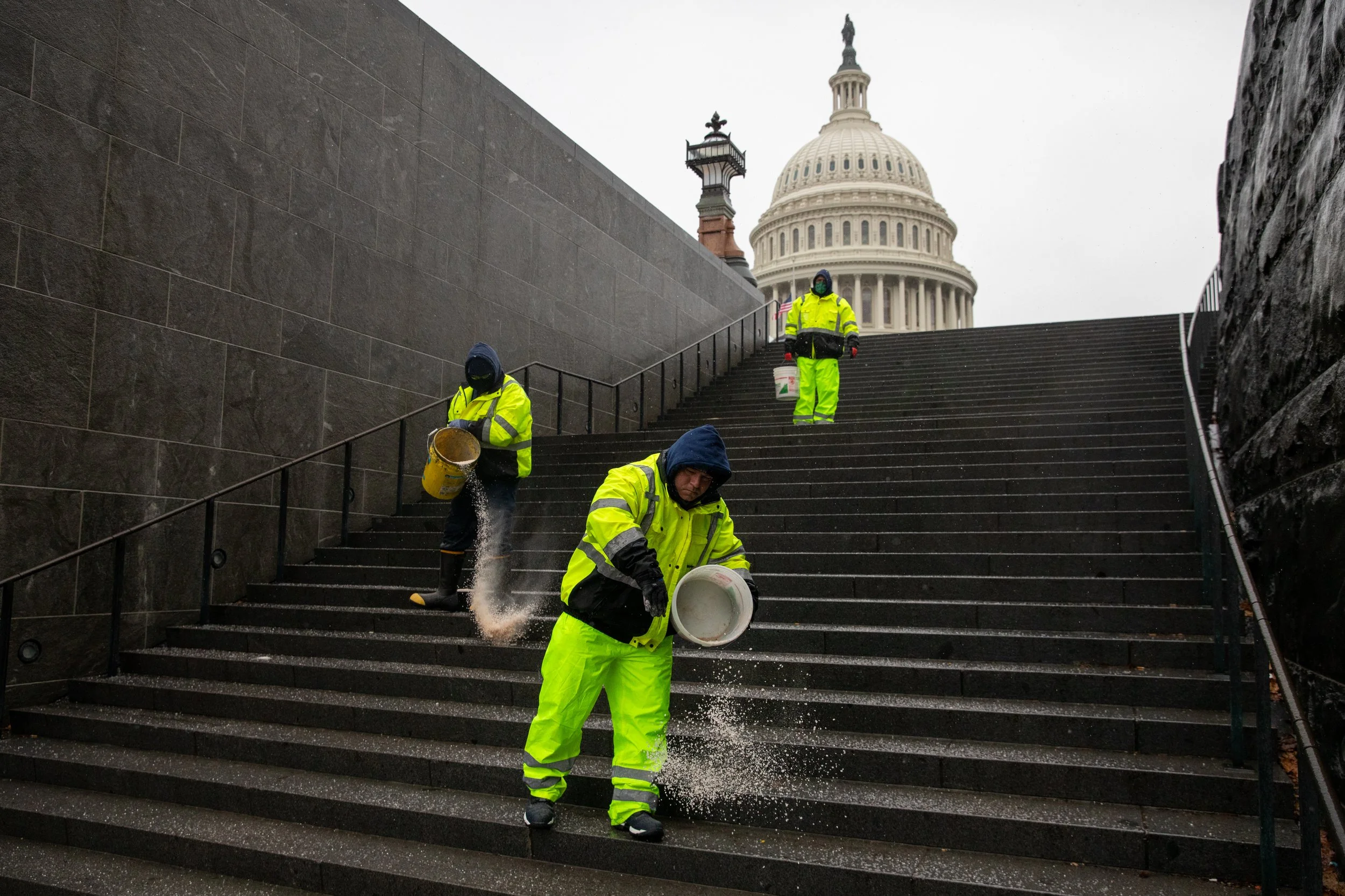  Workers salt the walkways around the U.S. Capitol in Washington, D.C., U.S., on Saturday, February 13, 2021. (Photo by Amanda Andrade-Rhoades/Sipa USA) 
