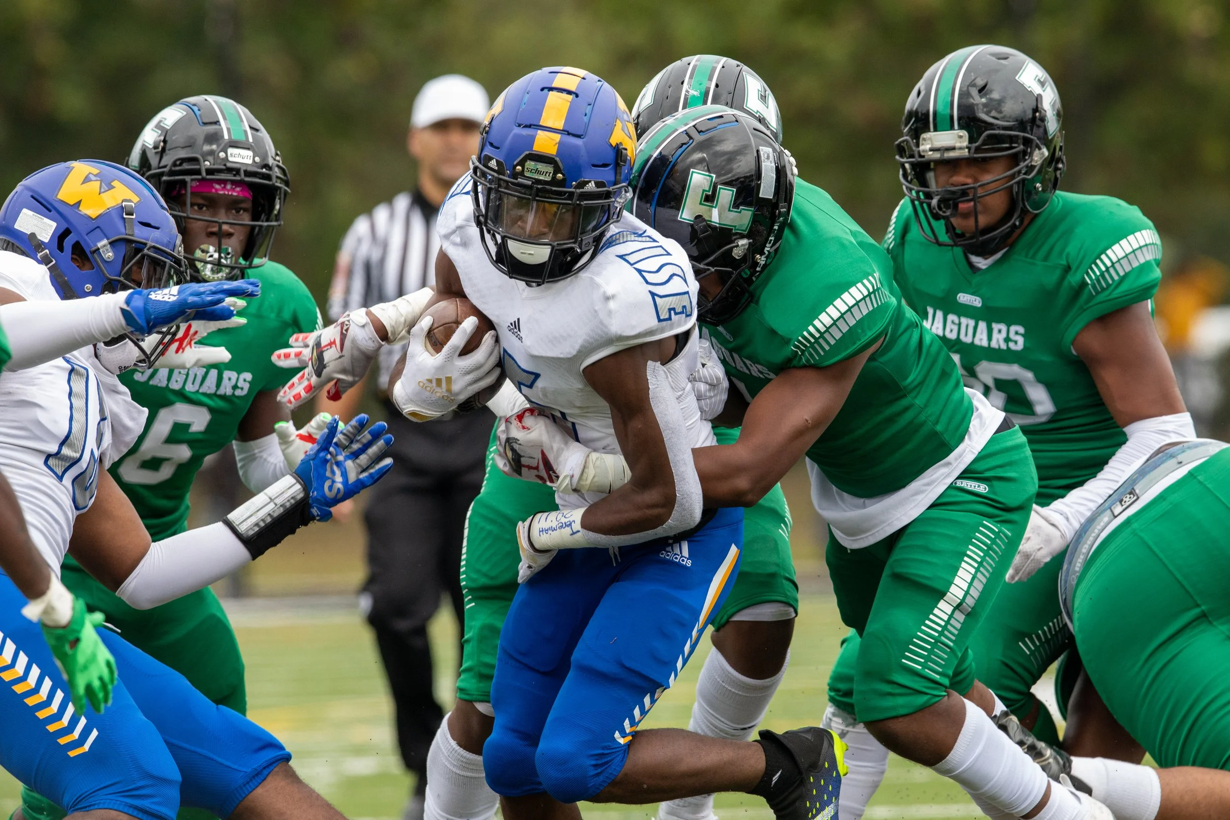 Dadrian Carter-Williams of Wise High School tries to evade other players during a varsity football game between Charles Herbert Flowers High School and Wise High School at Charles Herbert Flowers High School in Springdale, Maryland, on Saturday, Oct