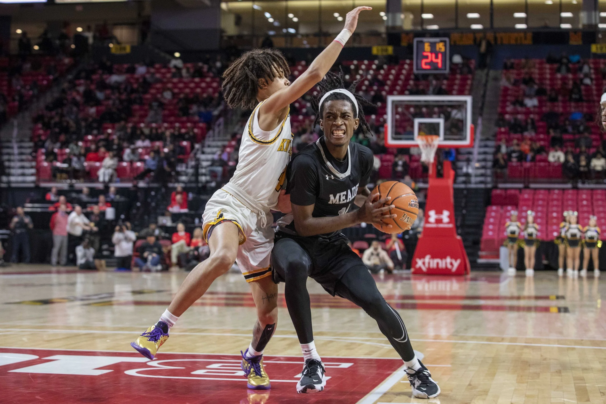  Xavion Roberson (11) of Meade High, defends the ball during a game between Parkville High School and Meade Senior High School at the MPSSAA basketball state championship, hosted at the Xfinity Center at the University of Maryland in College Park, Ma