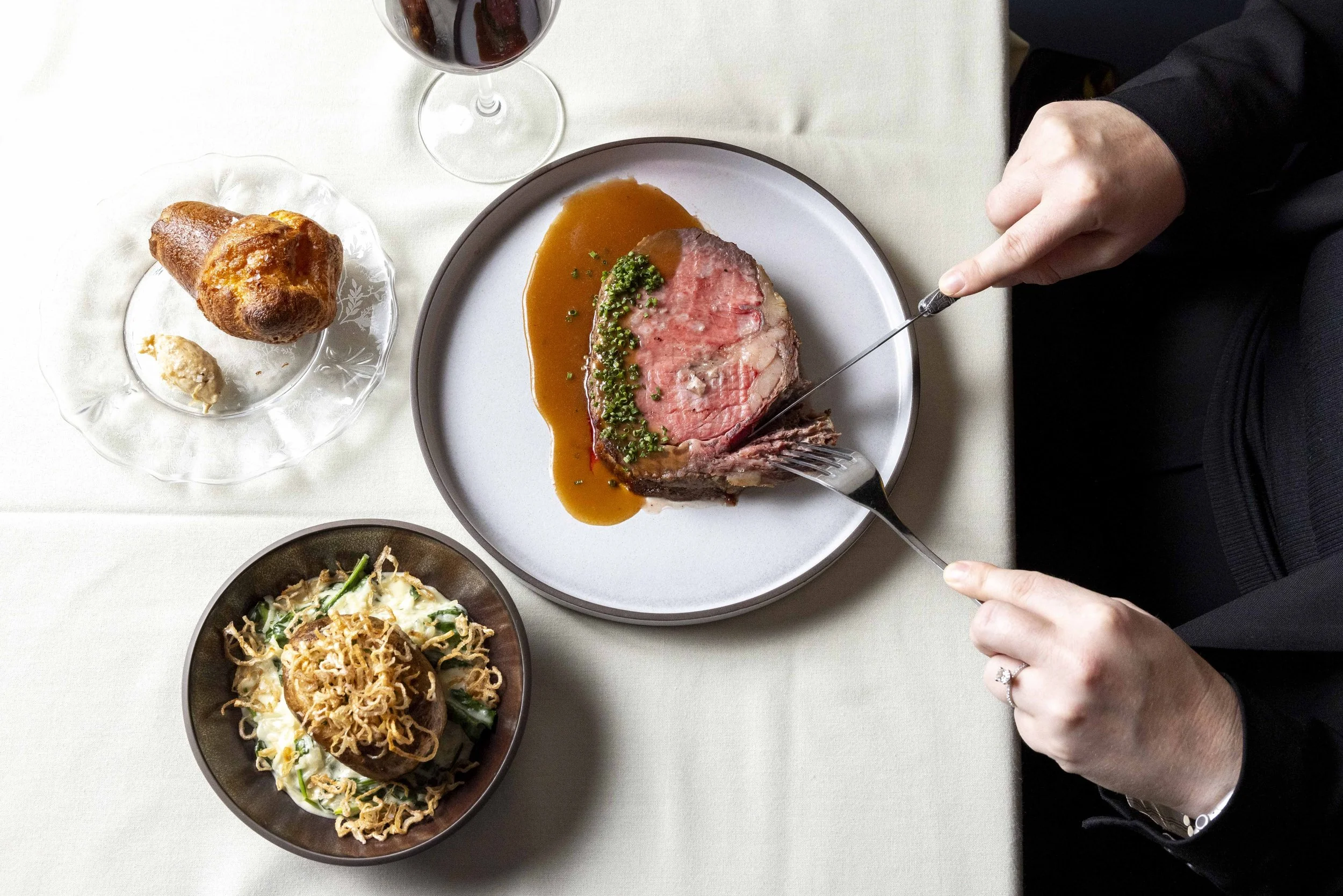  The prime rib dinner, which also features a popover and a twice-baked potato laden with creamed spinach, at Prospect in San Francisco on Friday, Nov. 15, 2024. (Amanda Andrade-Rhoades/The San Francisco Standard) 