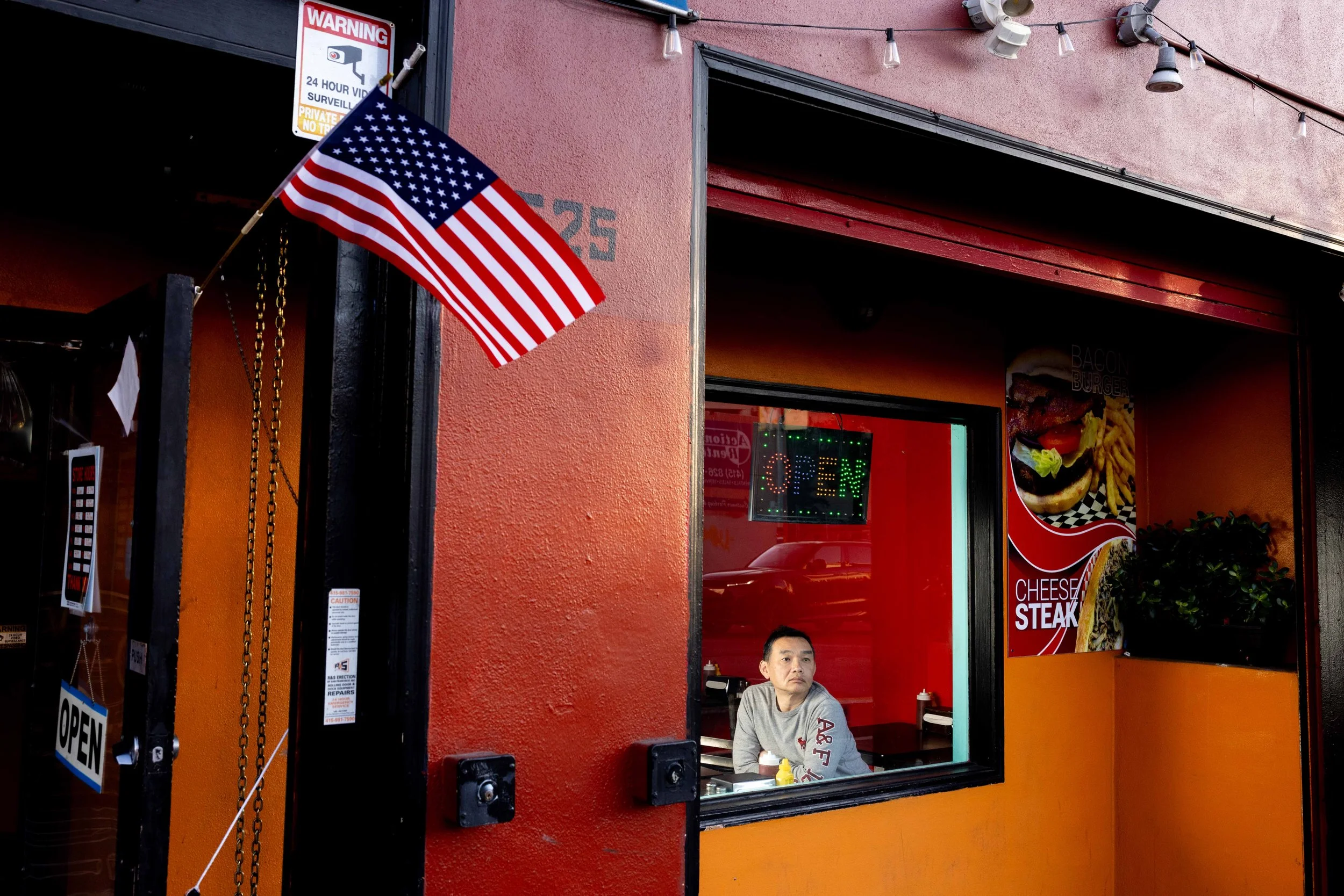  Fong Lau, owner of V Cafe, poses for a portrait at his restaurant in San Francisco on Wednesday, Feb. 26, 2025. Folsom street restaurants say nearby food trucks and hot dog vendors operate illegally and unfairly steal their customers. But rather tha