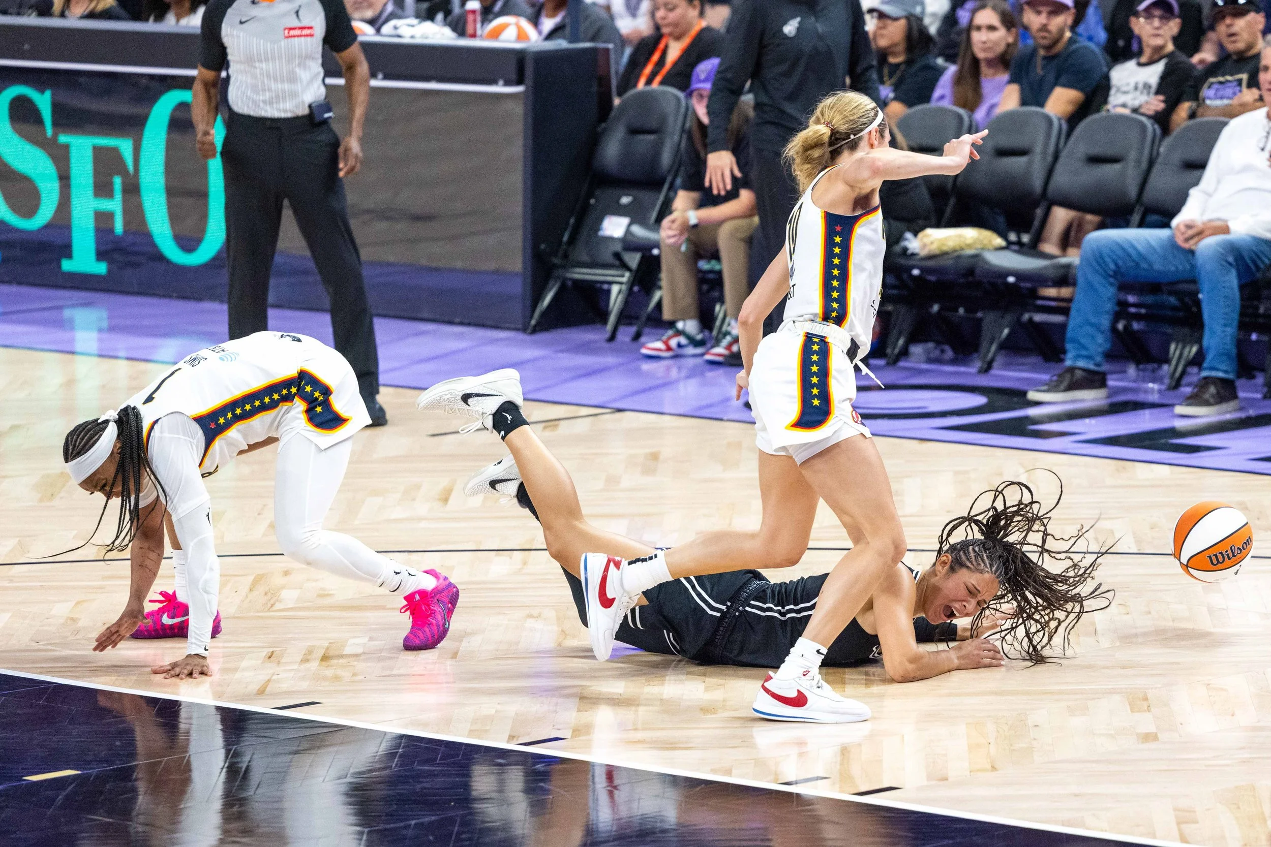Veronica Burton (22) falls to the ground during a game that pitted Golden State Valkyries against Indiana Fever at Chase Center on Sunday, August 31, 2025. (Amanda Andrade-Rhoades/The San Francisco Standard)
