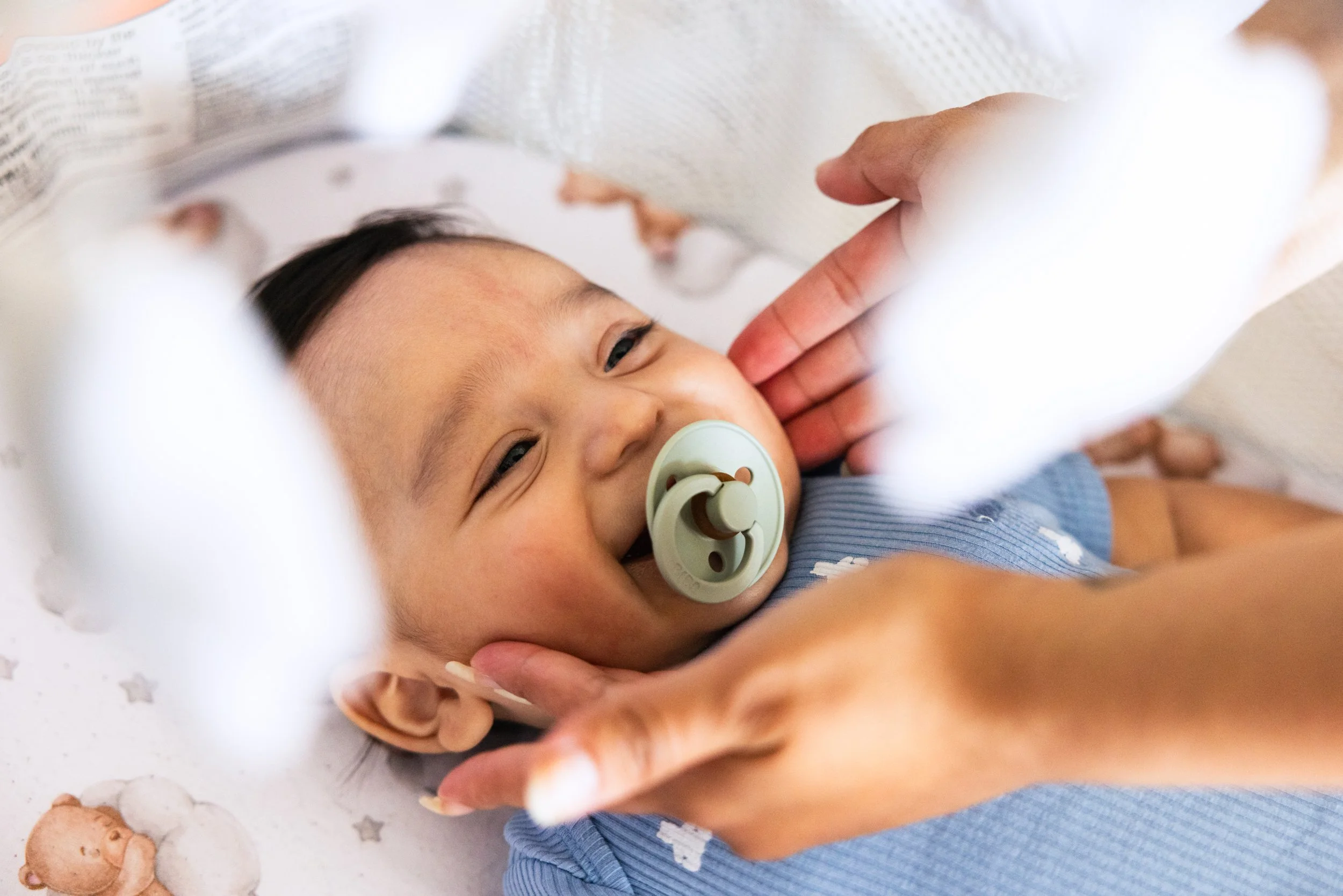 Franco Ramirez looks up at his mother Magali Hernandez at their home in San Francisco on September 24, 2024. Franco, who was born May 5, initially suffered from serious health issues and was hospitalized in a neonatal intensive care unit (NICU), wh