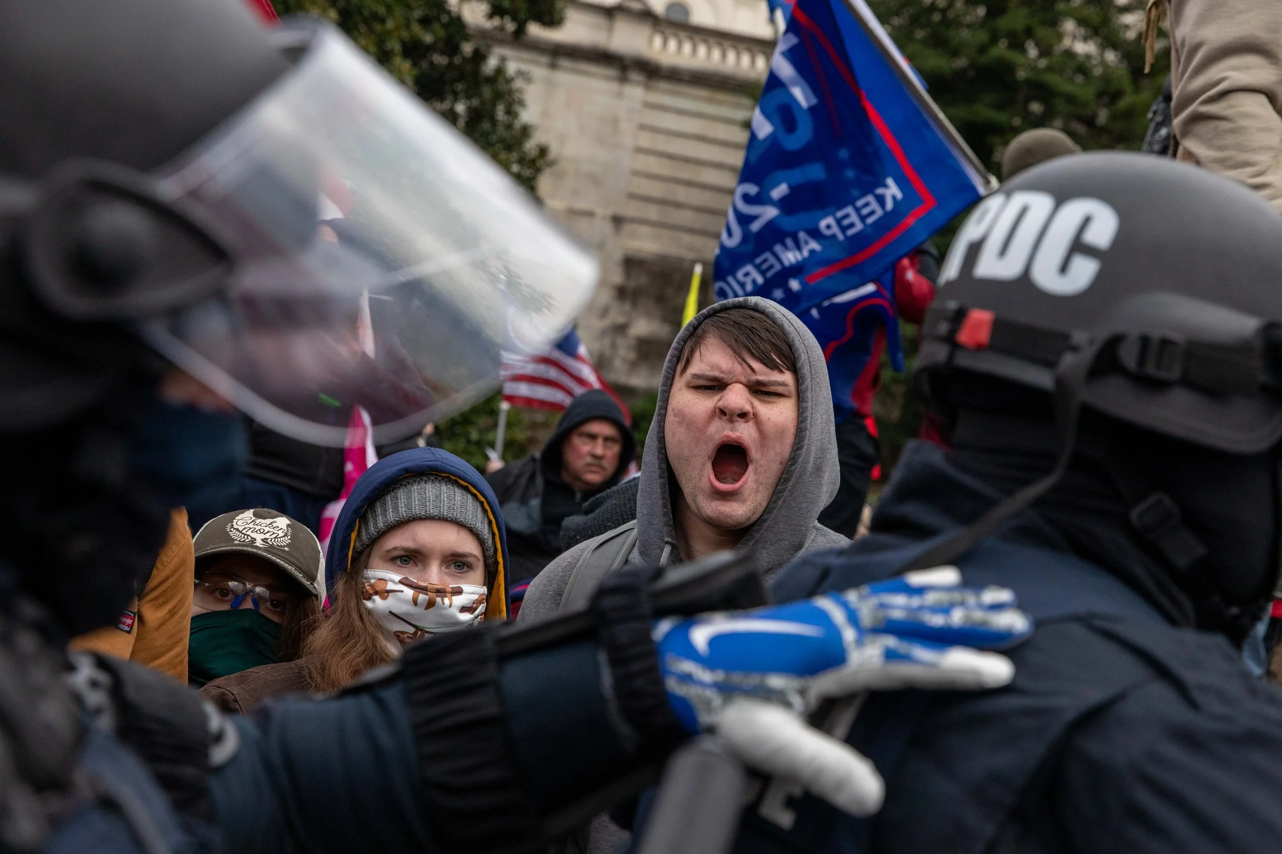  A Pro-Trump rioter screams at police officers amid an insurrection that resulted in the boundaries of the US Capitol being breached on Wednesday, January 6, 2021. (Photo made for The Washington Post) 