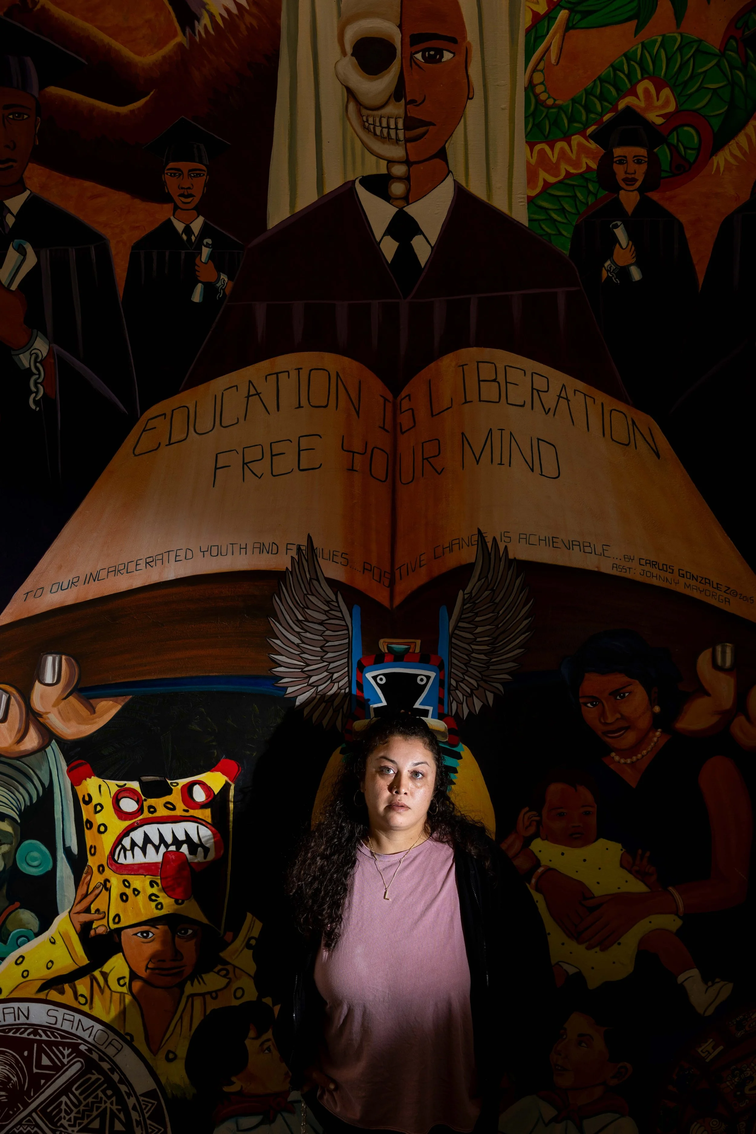  Lucero Herrera poses for a portrait by a mural near her office at the Juvenile Justice Center in San Francisco on Wednesday April 22, 2026. Lucero Herrera is a caseworker with the Juvenile Justice Center who works with young people accused of violen