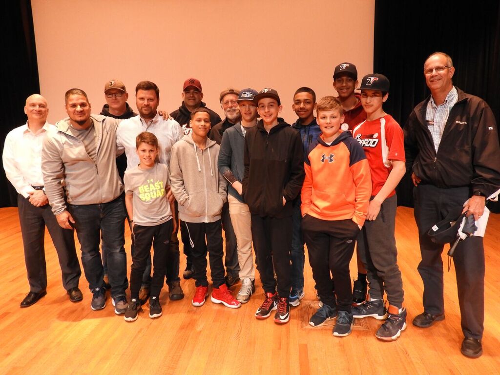 Eugene with players and coaches of Roberto Clemente League