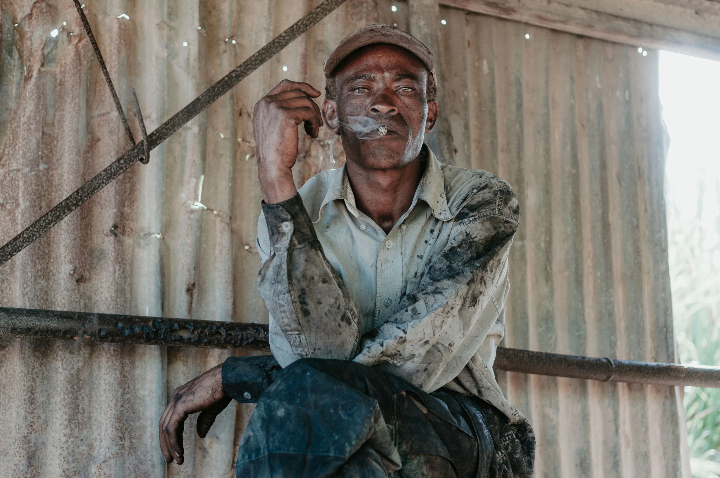 sugarcane-cart-worker-smoke-break-soot-field-sugar.jpg