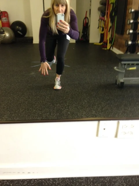Single Leg Squat. Reach one arm to the floor.