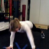 Midway into marching plank...and about to place the forearms on the floor.