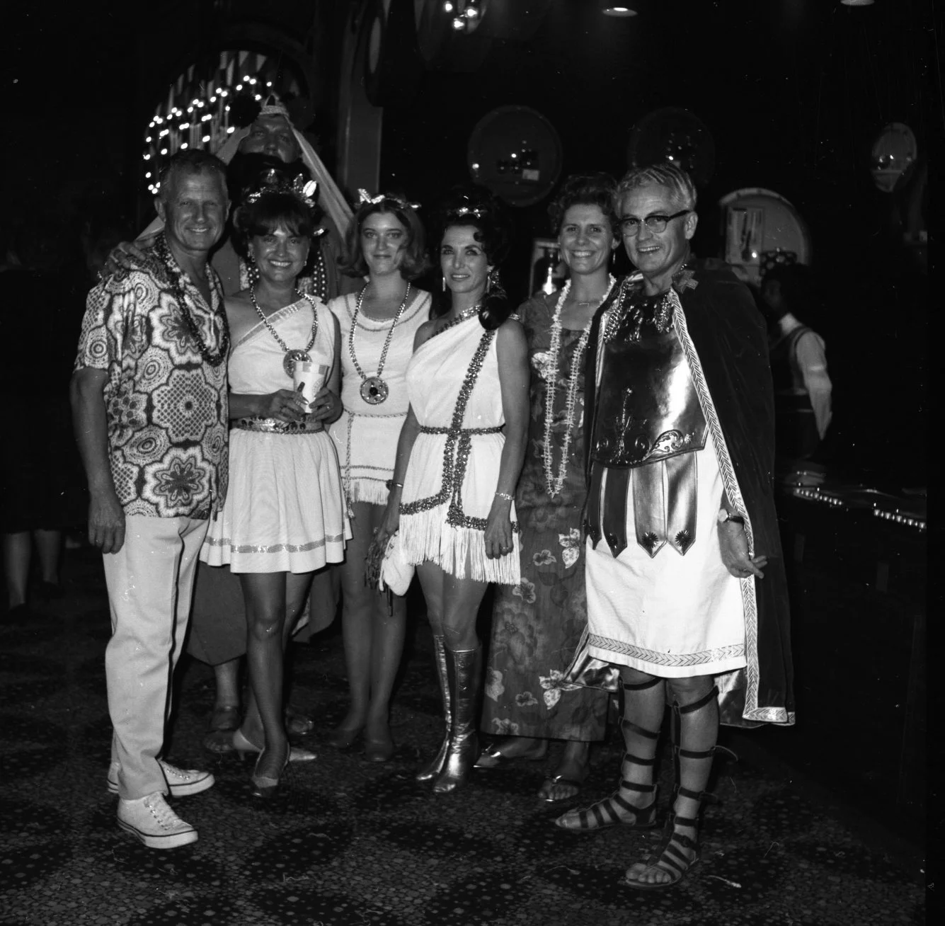 Tourists hang out with the staff at Caesars Palace