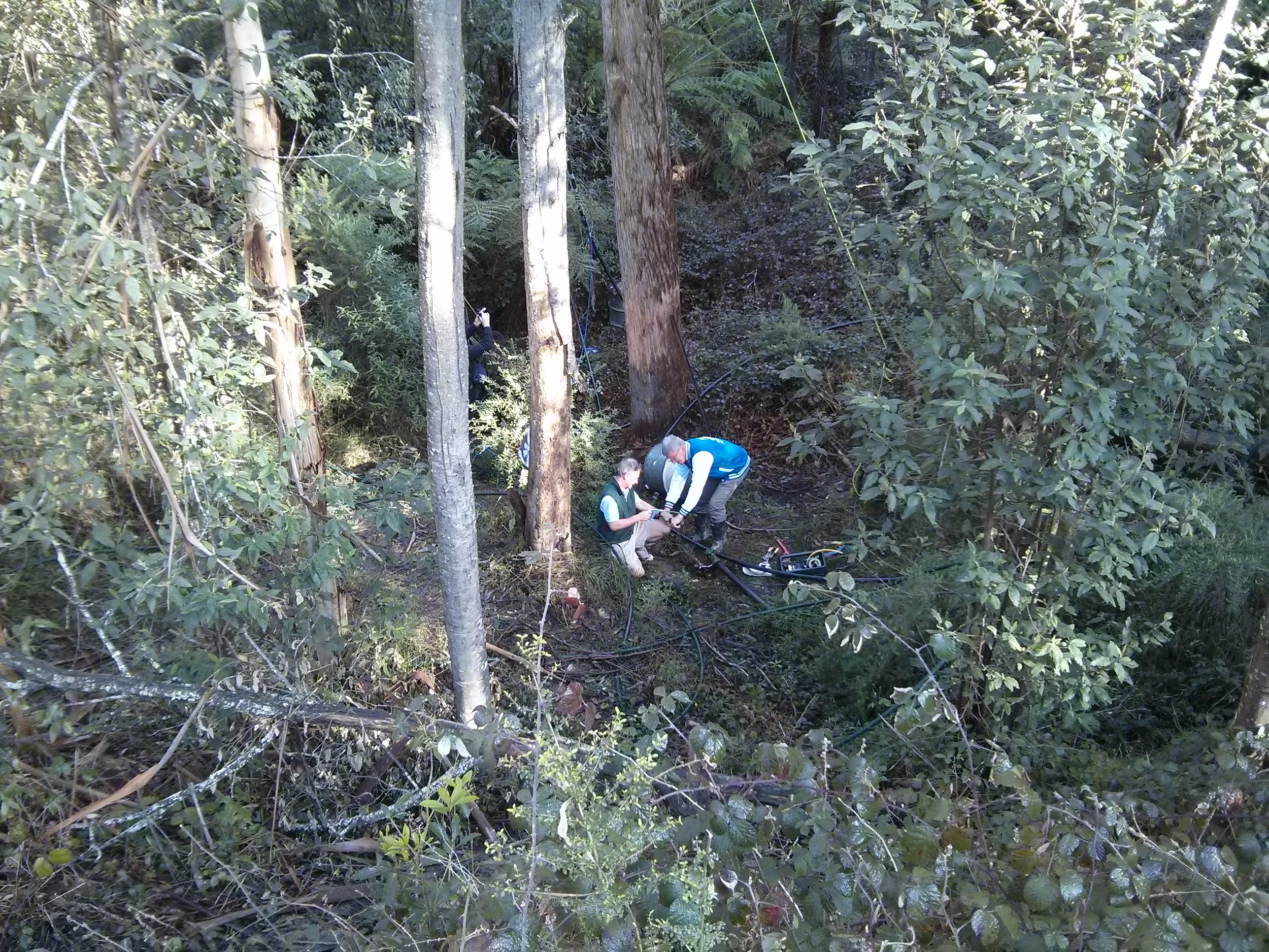 Roger and Craig testing the outlet leg of the siphon during some early tests in Gippsland