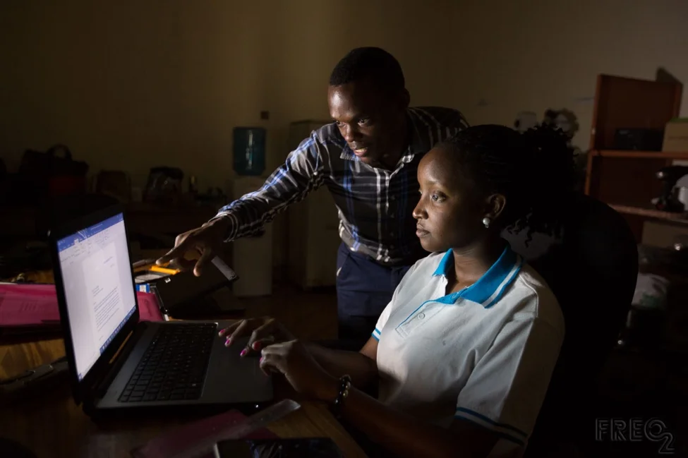 © Peter Casamento Photography/FREO2 FREO2 engineers Sheillah Bagayana and Ivan Muhumuza continue to work throughout intermittent power failures.