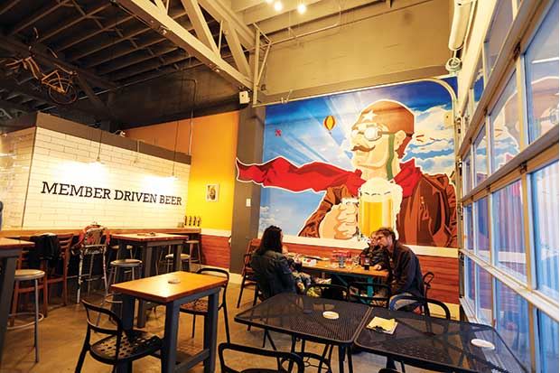 Members of the Flying Bike Cooperative Brewery help guide how the business is run, and even help select winning brews to be produced by the brewery