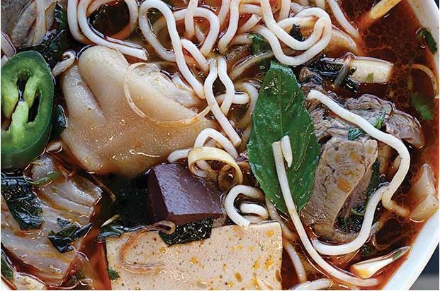 S1, the House Special Spicy Beef Rice Noodle Soup with beef shank,Vietnamese ham, tendon,white onions, basil and mint, pork blood cubes and pig trotters (pigs’ feet); from Dong Thap Noodles in Chinatown/International District