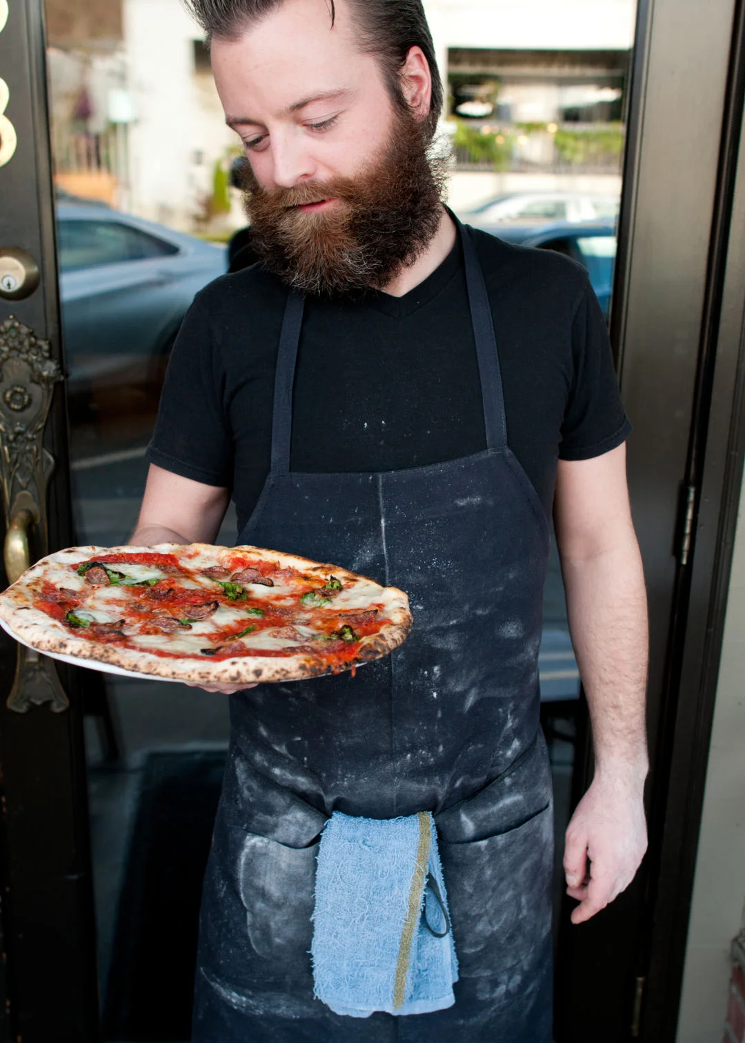 Former Bruciato pizzaiolo Brandon Thompson, a man perennially covered in flour. IMAGE: SARA MARIE D’EUGENIO