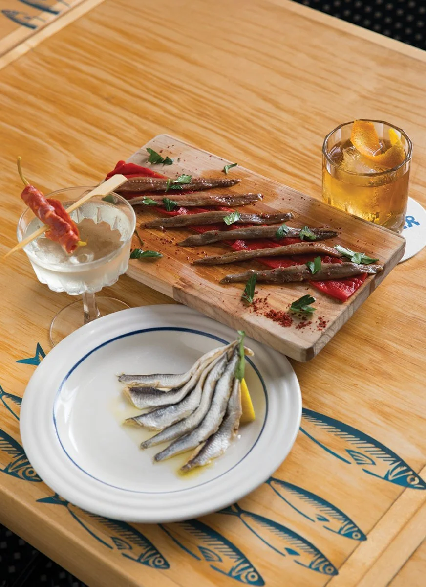 LITTLE FISH: Piquillos and anchovies at Jarr Bar pair perfectly with dainty cocktails