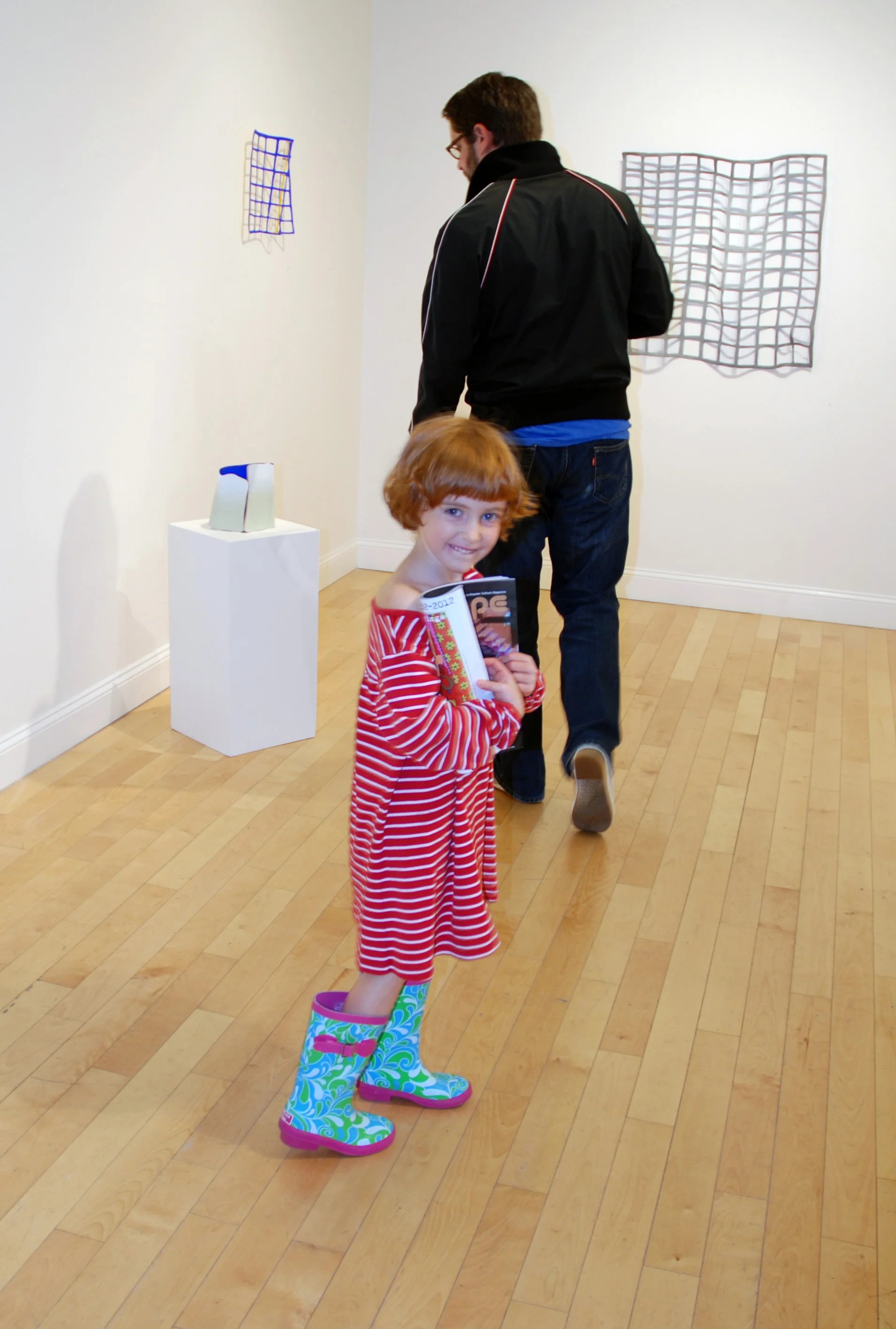 Gretchen and Matt Ransford with Lisa Perez's work in the Project Space.