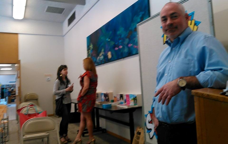 Moderator Joel Zlotnik. Plus, Laura Dave and Liz Fenton chatting in the background.