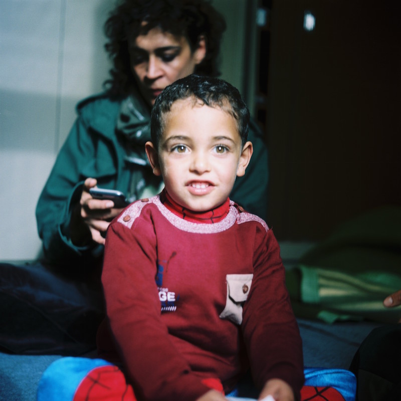  He arrived in Greece by boat with his mother, father and grandmother. As a family they are living in a squat in the centre of Athens established by volunteers. 