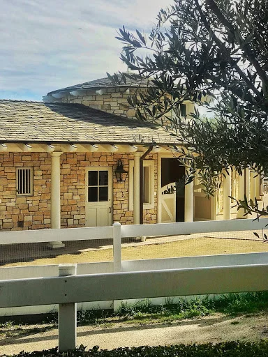 The enchanting turreted barn at the top of our driveway: inside live three fabulous pigs and two mini horses