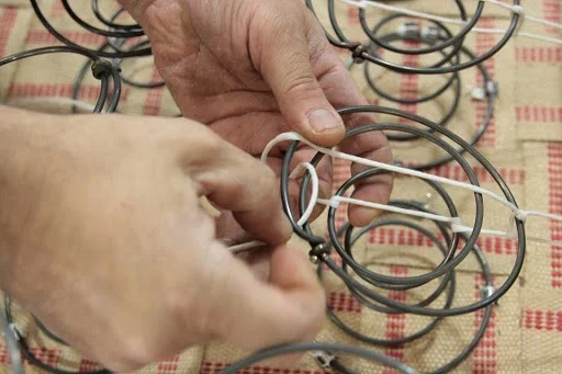 At Jonas (above and below) hand tied springs attached to kiln-dried maple frames forming the foundation for furniture that can be passed down from one generation to the next.