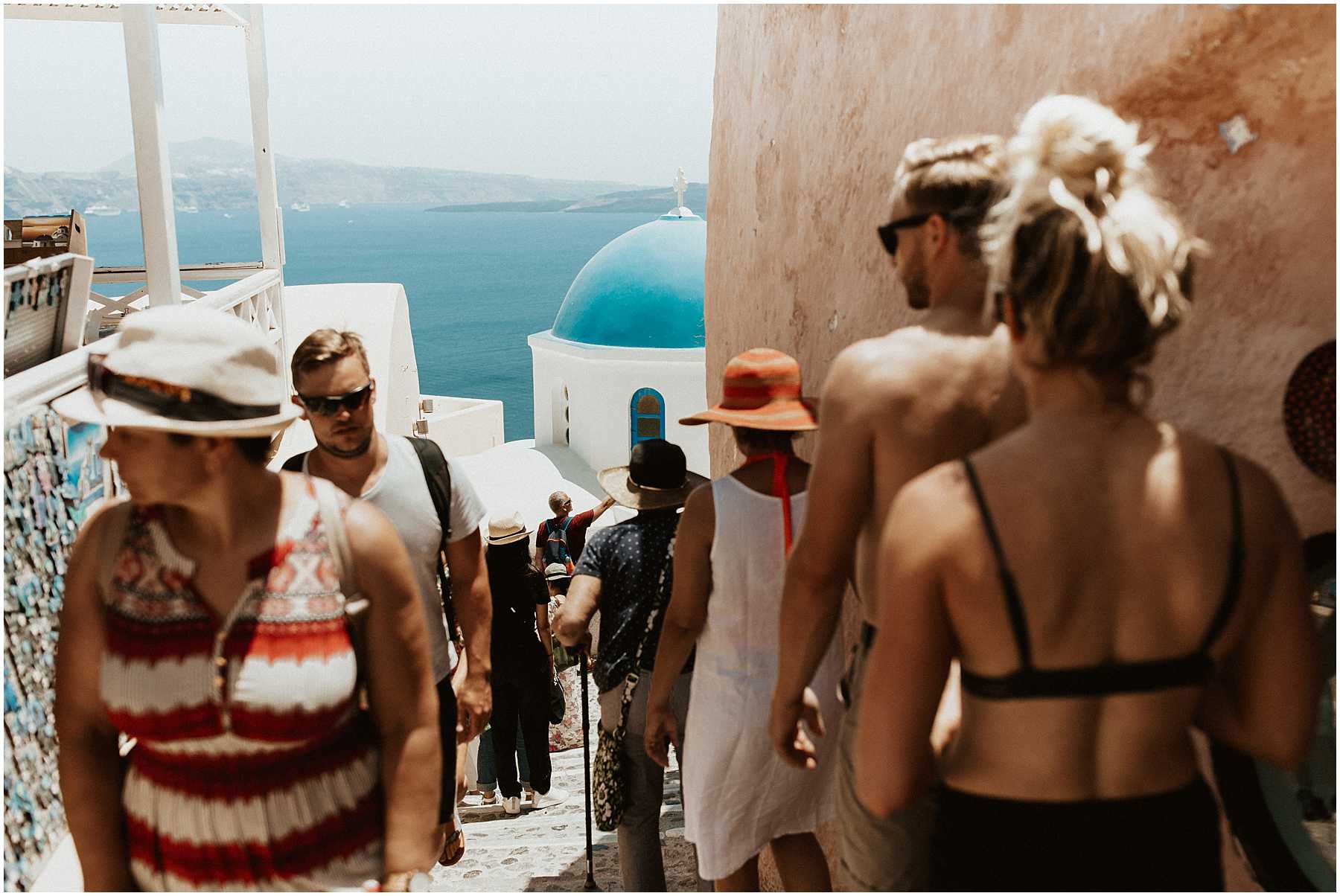 A couple walking the streets in Oia Santorini