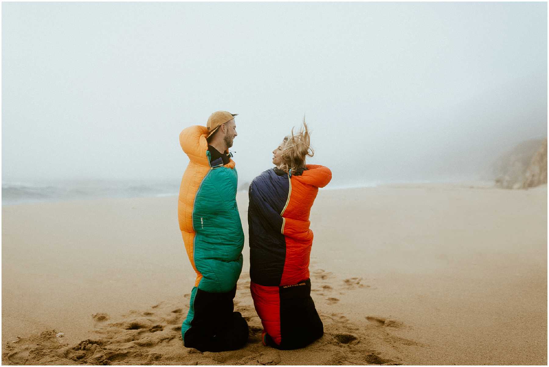 A couple on a beach in Big Sur