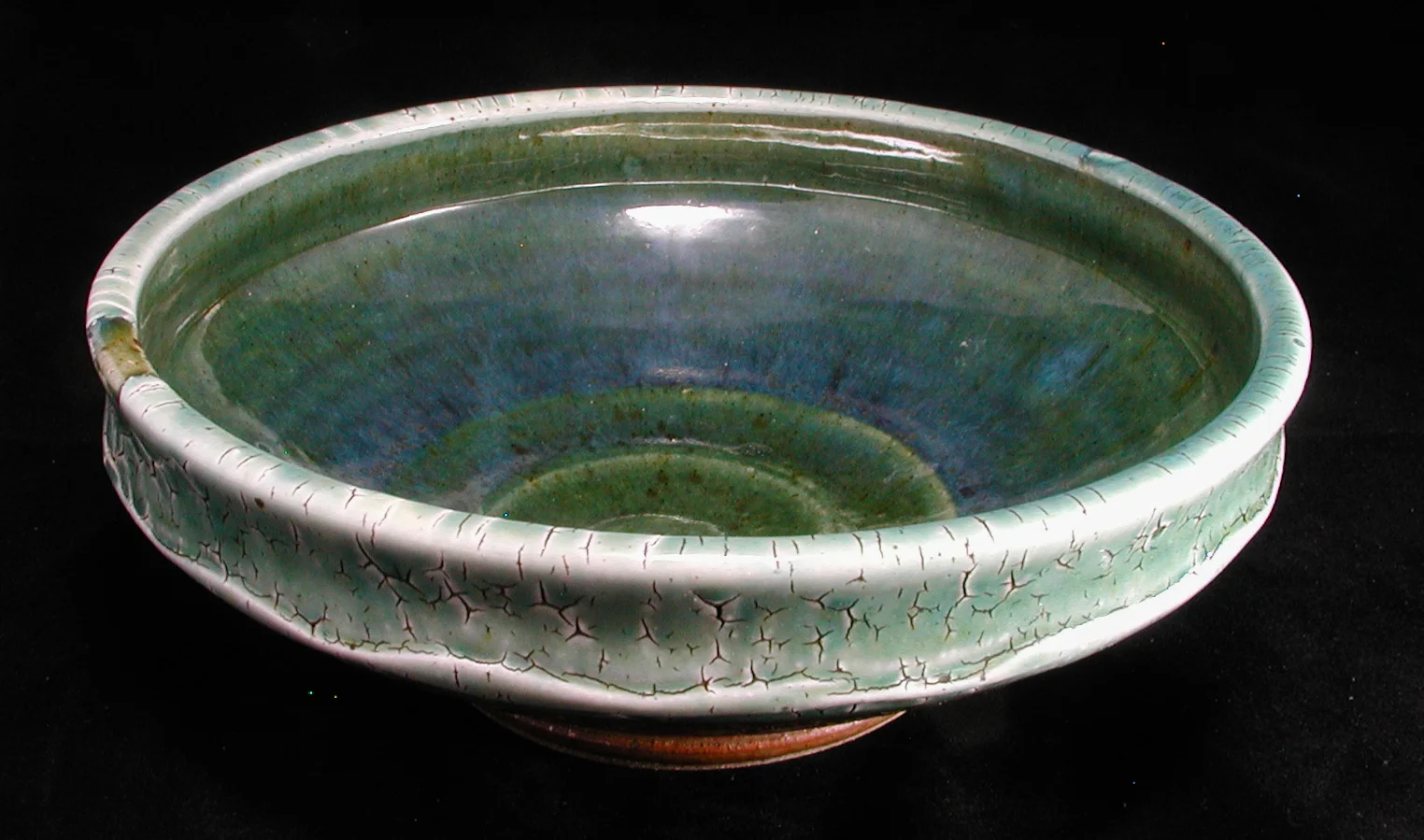 Stoneware bowl with crackle slip, ash glazes.