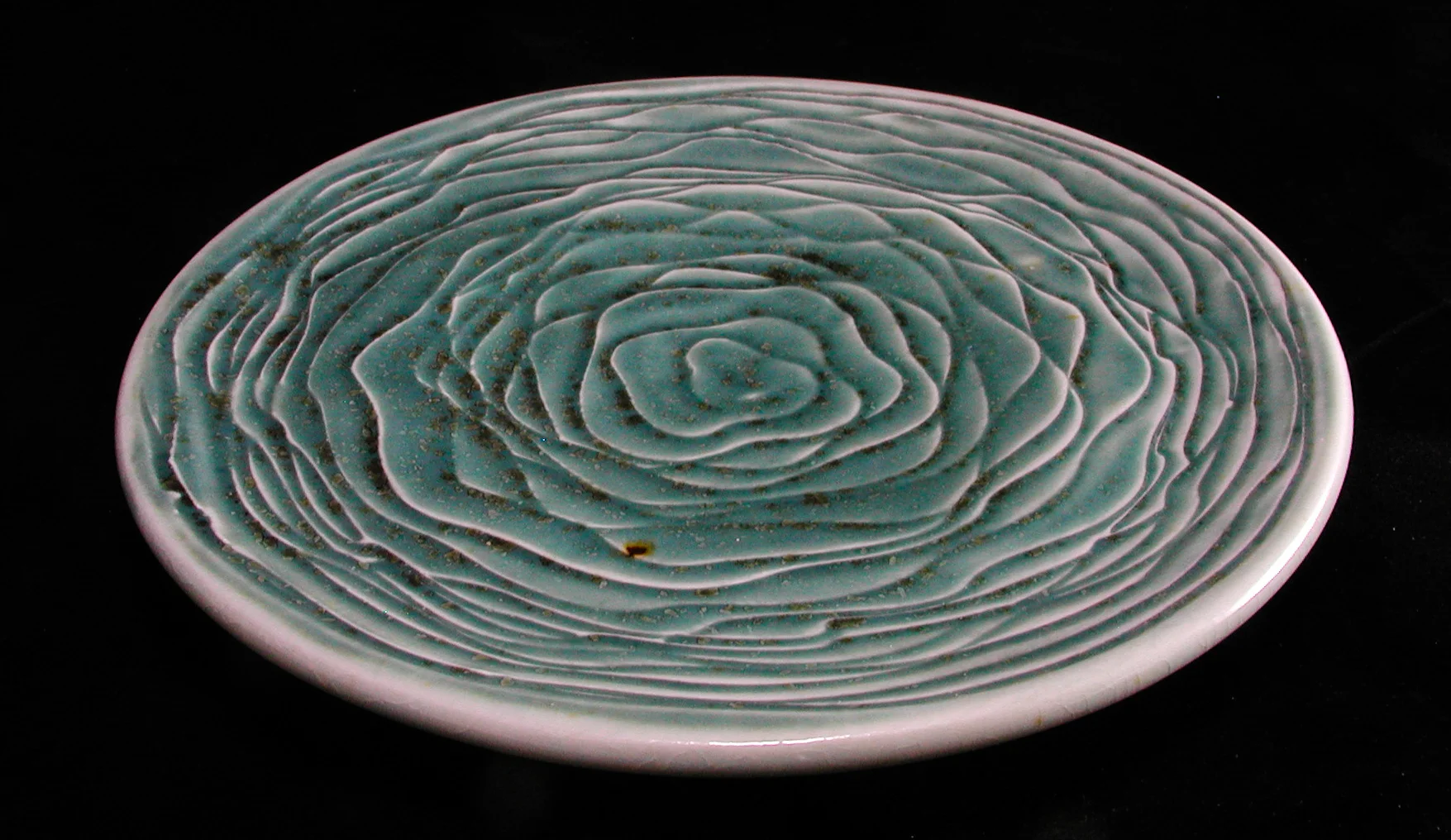 Carved Porcelain Plate with green ash glaze