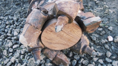 Hollow stem auger bit with sacrificial wooden plug.