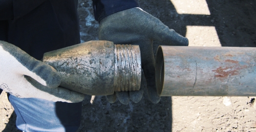 The cutting shoe and outer casing stays in-situ as the liner is extracted.