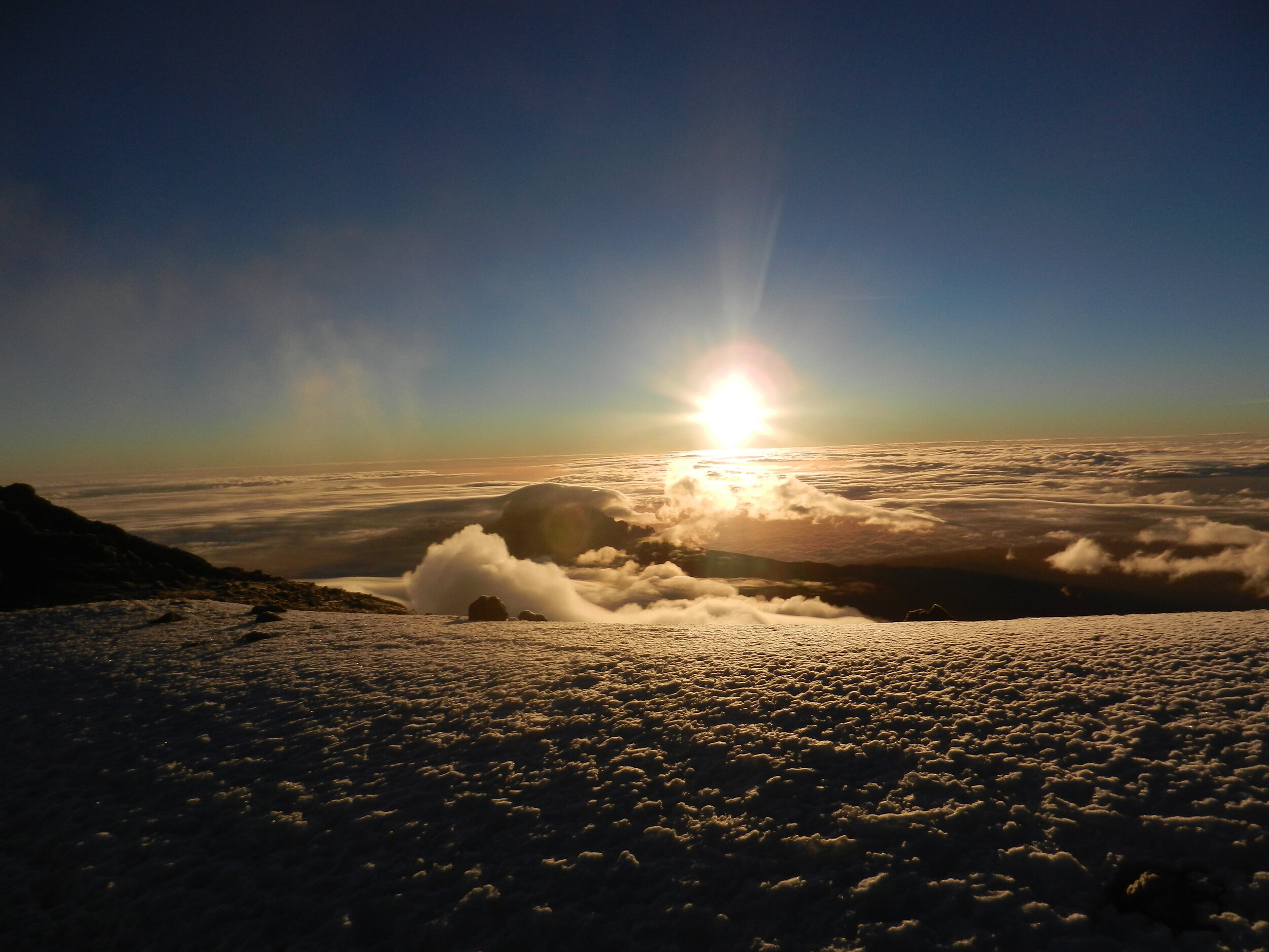 I snapped this photo at the summit of Mt. Kilimanjaro, Tanzania at 19,341 feet!