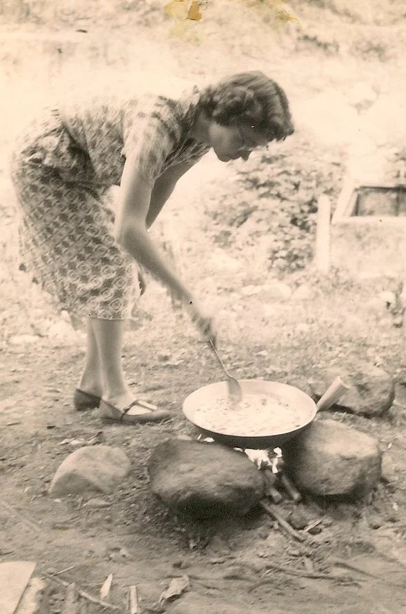 Vickie cooking outdoors in Africa.