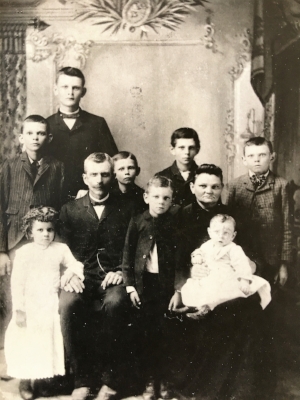 The Henry and Margaretha Buerer family. Forest standing between his mother and father.
