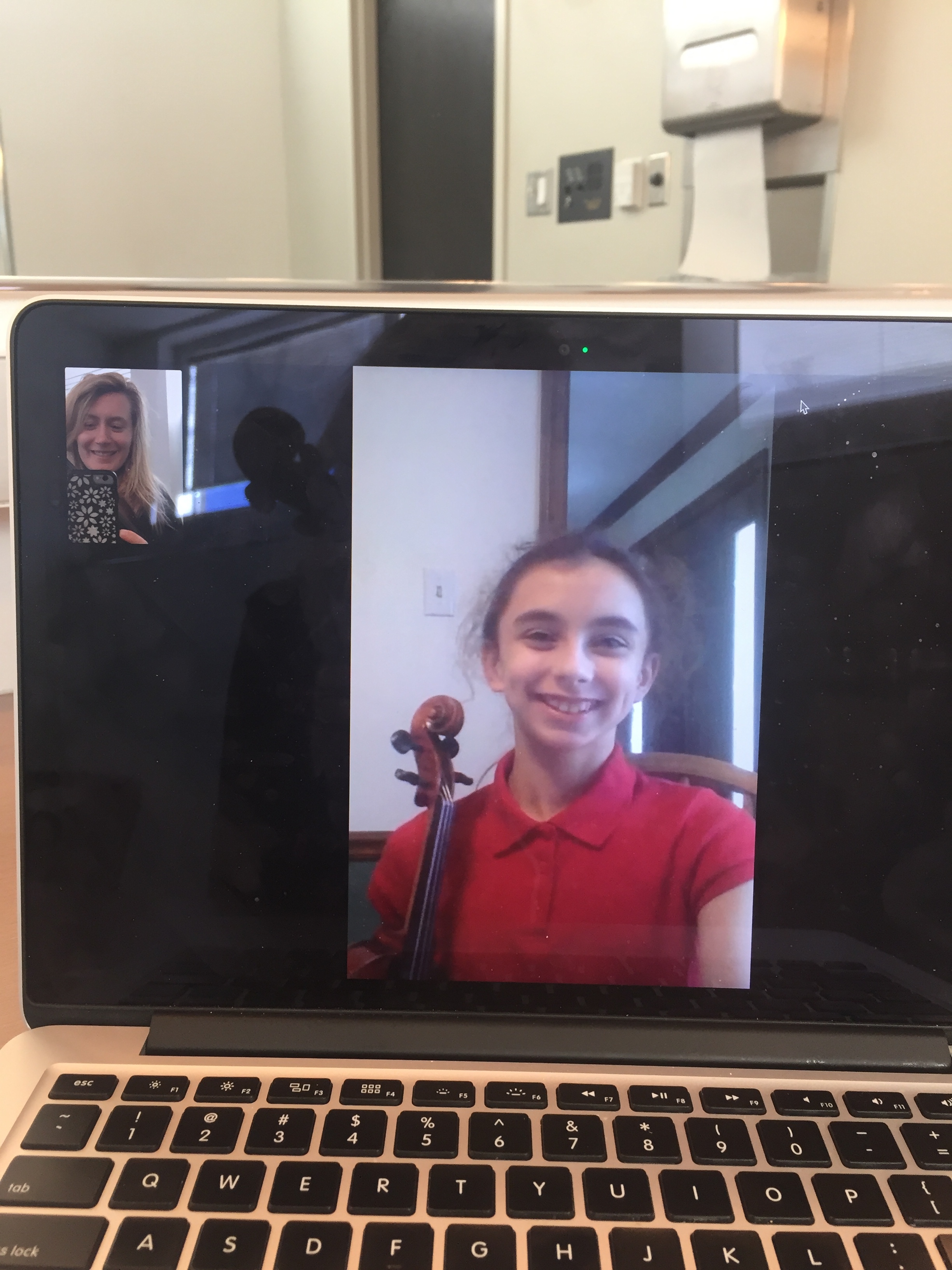 Myself on FaceTime with my young fiddle student, Brianna.