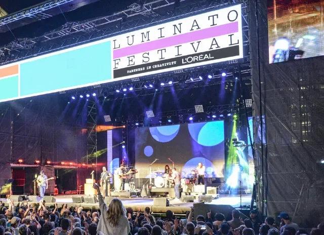 Festival signage and branding displaying L’Oréal as a partner alongside Luminato Festival promotional materials.
