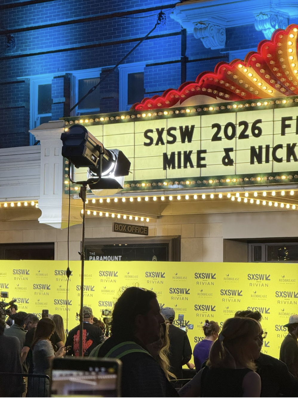 Exterior view of the Paramount Theatre in Austin during SXSW 2026 with festival signage.