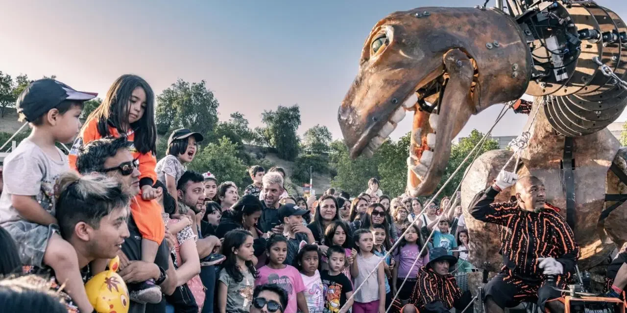 Performers on stage in costume during a theatrical production at the Santiago a Mil International Theatre Festival.