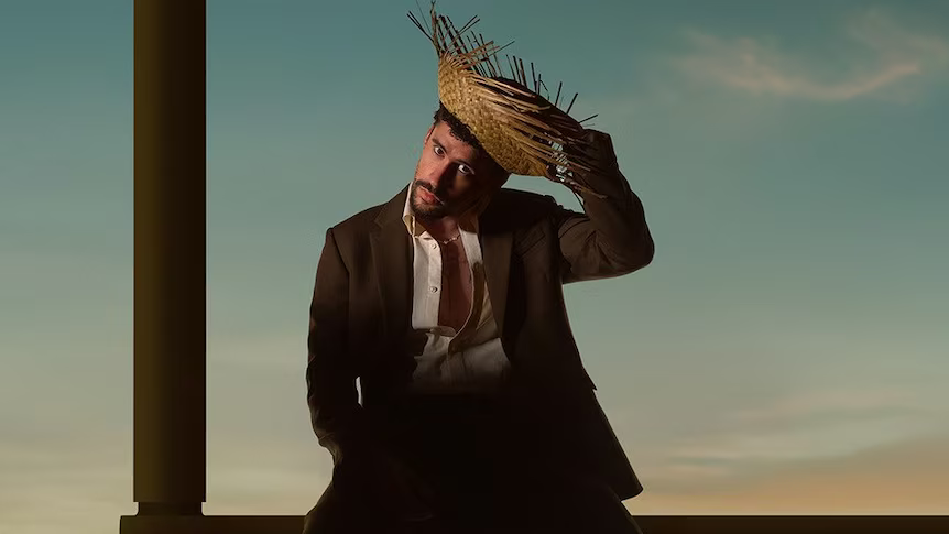 Close-up image of Bad Bunny wearing stage outfit and accessories during a public appearance.