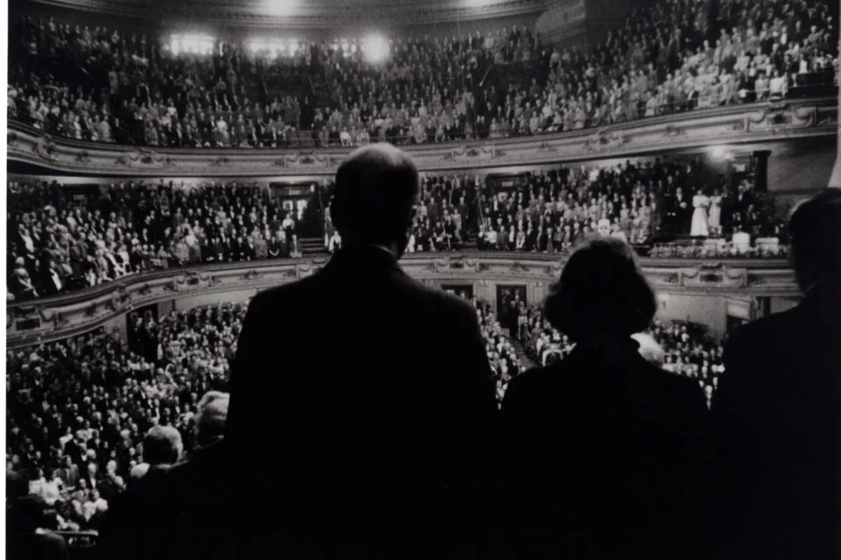 Orchestra performing on stage with seated musicians and audience at the opening concert of the Edinburgh International Festival in 1947.