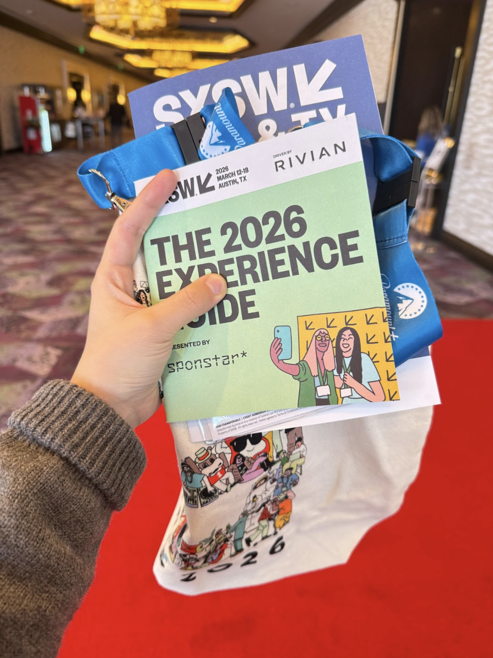 SXSW 2026 Experience Guide booklet displayed with branding from Rivian.