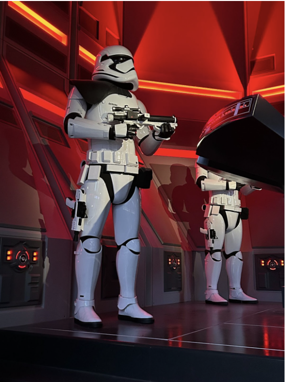 People dressed as Stormtroopers standing together in costume at an event.