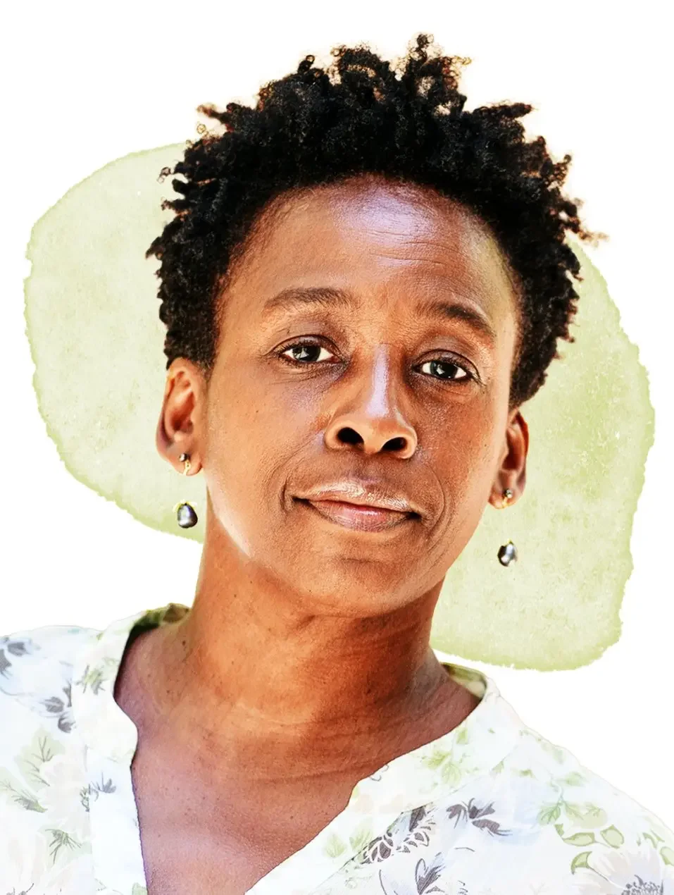 Headshot image of a Black woman with short hair and floral shirt
