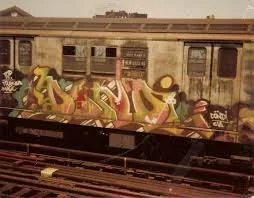 1970s NYC subway train with colorful tagging
