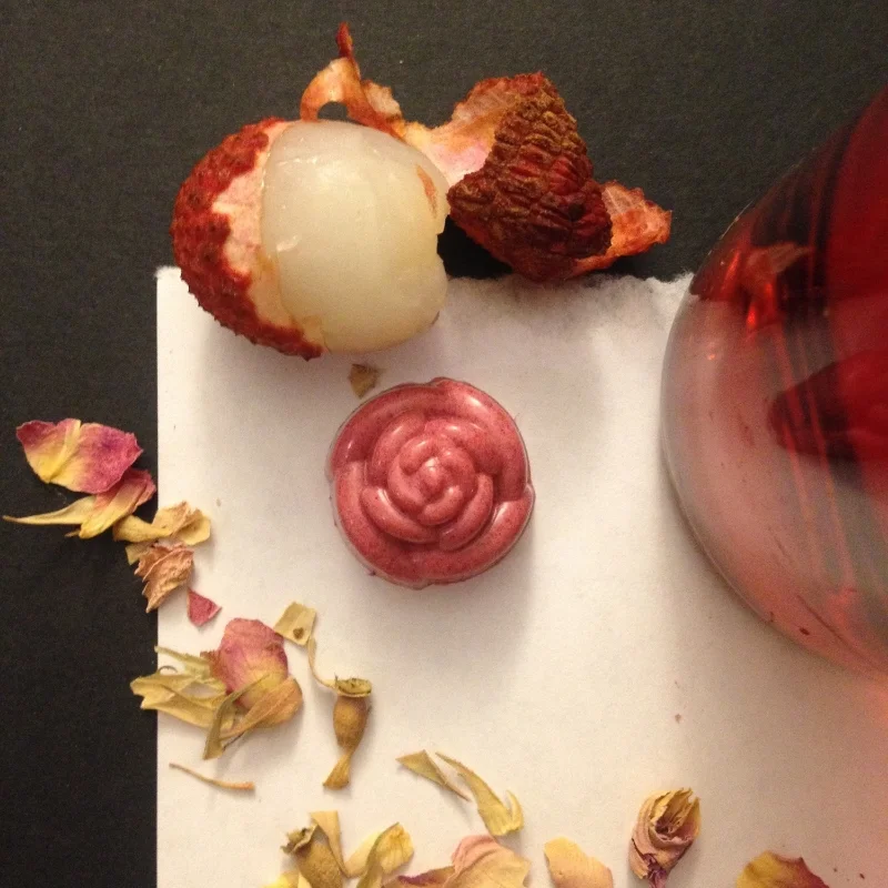 La Vie en Rosé: Dark chocolate ganache infused with lychee, a hint of rose tea, and dry rosé. The shell is tart raspberry and 31% white chocolate. 